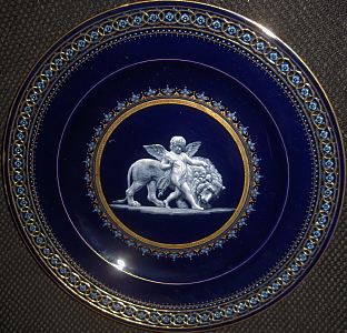 Meissen plate in French Enamel (Limoges) style with allegorical painting after Thorvaldsen. Cupid and Lion